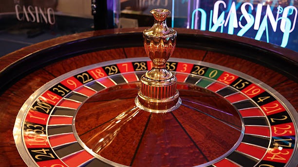 Mega Wheel live game screen on goldenqq with nearby slot tiles